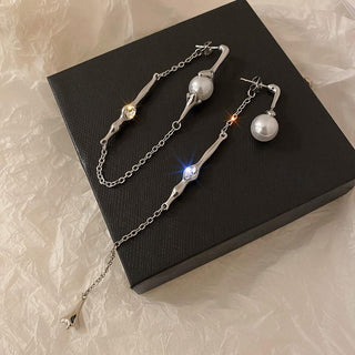 A two-piece pearl chain asymmetric rhinestone tassel long earring